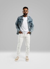 Fototapeta premium Handsome young african american guy posing in studio - isolated