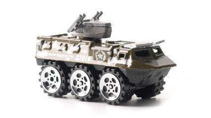 Fototapeta na wymiar Toy metal armored personnel carrier. Model military equipment.