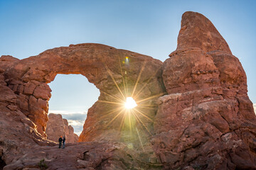 hiker enjoying the warm sun rays at turret arch in arches national park in utah usa © DEN