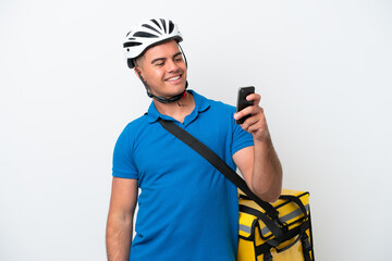 Young caucasian man with thermal backpack isolated on white background making a selfie
