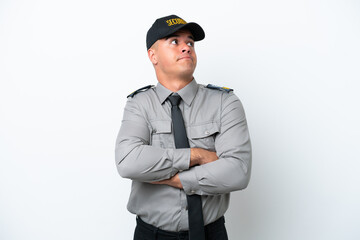Young caucasian security man isolated on white background making doubts gesture while lifting the shoulders