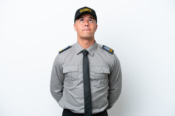 Young caucasian security man isolated on white background and looking up