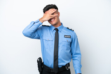 Young police caucasian man isolated on white background covering eyes by hands and smiling