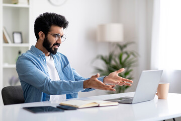 Working Stress. Angry Young Indian Male Freelancer Having Problems With Laptop Computer