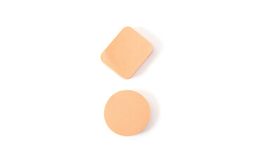 Beauty sponges for applying makeup on a white background. Top view, flat lay