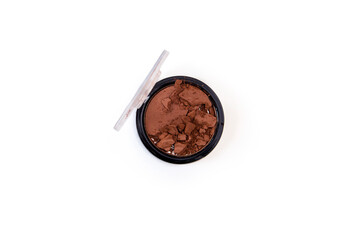 Broken makeup blush, as a sample of a cosmetic product on a white background. Top view, flat lay
