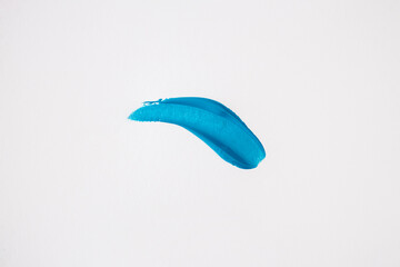 Blue smear on a white background. Top view, flat lay