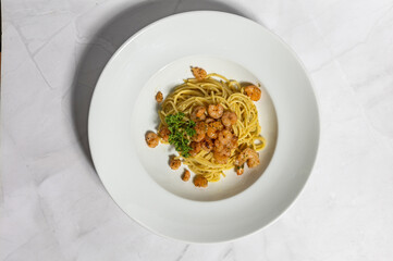 Pasta with prawns served on a plate