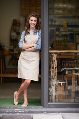 Happy, arms crossed and portrait of woman at restaurant for small business, coffee shop or waiter. Entrepreneur, retail and smile with female barista at front door of cafe for diner and food industry