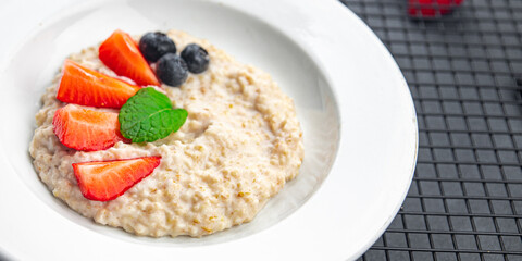 oatmeal porridge breakfast berries healthy meal food snack on the table copy space food background rustic top view