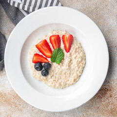 oatmeal porridge breakfast berries healthy meal food snack on the table copy space food background rustic top view
