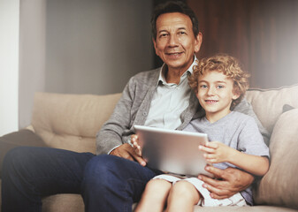 Tablet, child or portrait of a happy grandfather streaming movie or film on online subscription at home. Relax, grandparent or child loves watching fun videos with a senior or mature old man on sofa