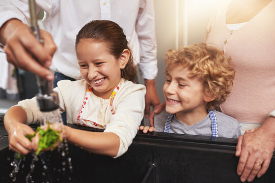 Food, Washing Or Happy Kids Learning Cooking Skills For A Healthy Dinner With Green Vegetables At Home. Kids Learning, Hands Or Young Siblings Cleaning Diet Meal For Nutrition In Kitchen With Parents