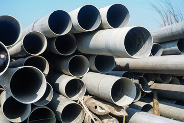 Background of big plastic pipes used at the building site.The many big pipes on the ground. PVC pipes bacground