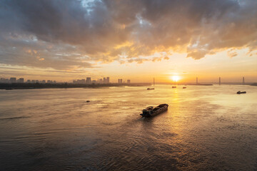 Red River (song Hong) landscape at sunset with Nhat Tan bridge on background in Hanoi, Vietnam
