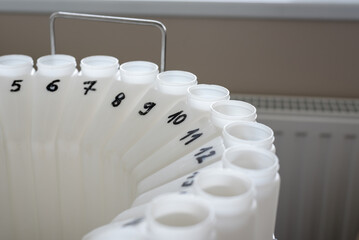 numbered containers of an automatic sampling machine for sampling wastewater and surface water for chemical analysis
