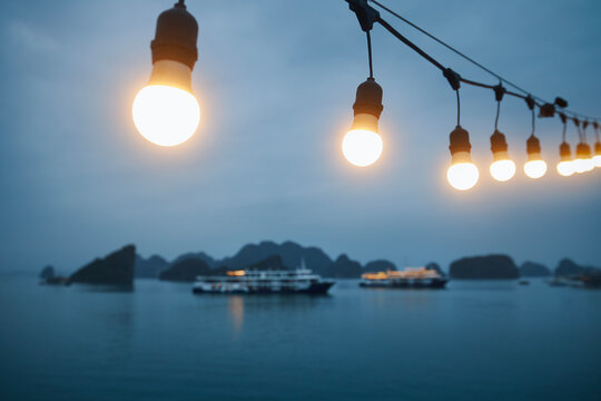 Man enjoying magnificent view from cruise ship sailing between islands. Popular tourist destination with karst formations in sea, Ha Long Bay in Vietnam.
- Powered by Adobe
