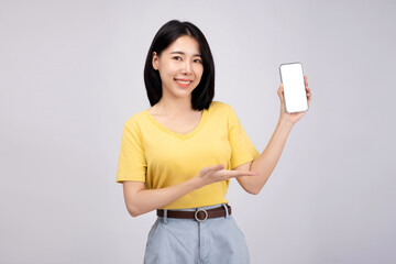 Portrait of  happiness Asian girl use smart phone wear yellow shirt on white color background