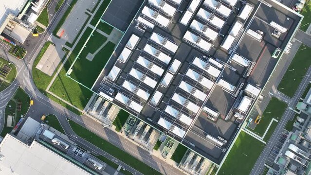 Explore the cutting-edge technology and futuristic infrastructure of a large-scale data center in the flat lands of the Netherlands through this captivating aerial top down drone video.