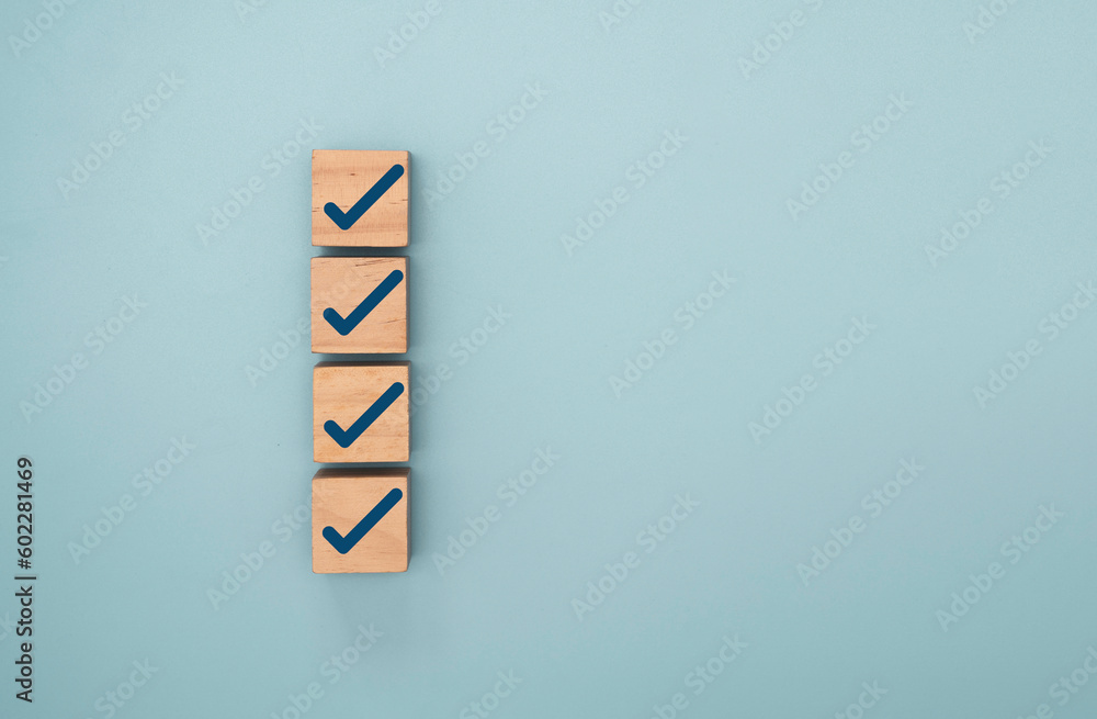 Aufkleber Blue correct sign and tick check mark to wooden cube block with copy space for checklist of ISO quality control and approve business product concept.