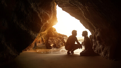 Portrait of happy couple, embracing in the hidden cave at the Querim beach, North Goa, India. - obrazy, fototapety, plakaty
