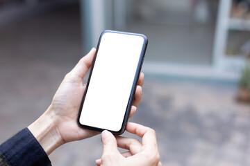 cell phone blank white screen mockup.hand holding texting using mobile on desk at office.background empty space for advertise.work people contact marketing business,technology