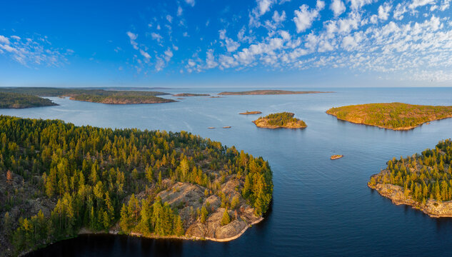 Russia. Karelia. Mirror reflection in water. Stones in the water. Ladoga lake. photographed from heights
