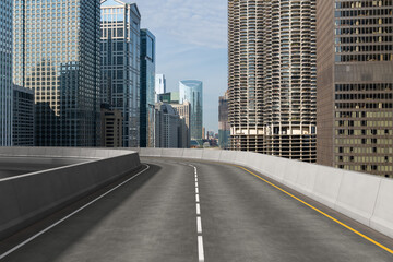 Obraz premium Empty urban asphalt road exterior with city buildings background. New modern highway concrete construction. Concept of way to success. Transportation logistic industry fast delivery. Chicago. USA.
