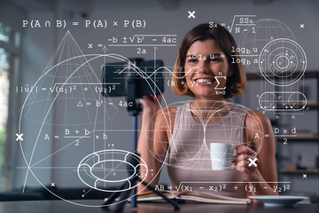 Happy woman is making video blog using smartphone on a tripod explaining with hands at office...