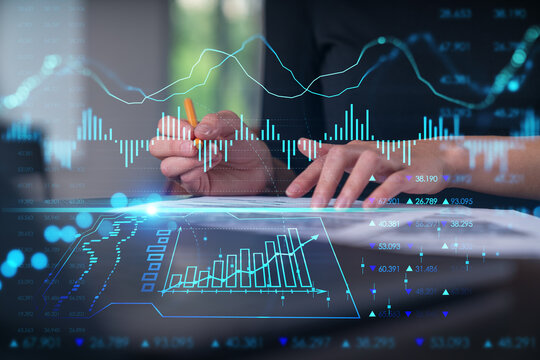Businesswoman in formal wear taking notes signing contract at office workplace. Concept of important working moments, document sign, working process, concentration. Hands shot. Forex graph hologram