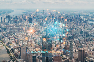Aerial panoramic helicopter city view of Upper Manhattan, Midtown and Downtown, New York, USA. Decentralized economy. Blockchain, cryptography and cryptocurrency concept, hologram