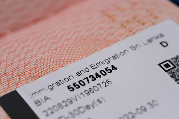 close-up part of page of document, foreign passport for travel with Sri Lanka visa, tourist visa...