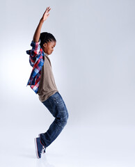 Dance, hip hop and young child dancer dancing isolated in a white studio background in a pose feeling excited. Talent, mockup and kid or child with energy and skill ready for breakdance performance