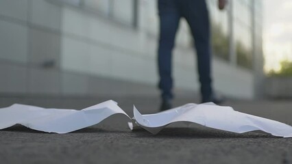 The engineer looks at the drawing. the engineer breaks the drawing. the engineer leaves the construction site. slow motion video. High quality Full HD video recording