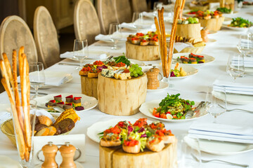 Cheese, sandwiches, bread and aperitifs in a restaurant