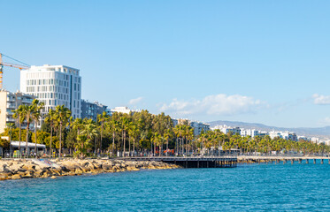 Fototapeta na wymiar View of beautiful coast with promenade of Limassol, Cyprus from pier during spring sunny day.