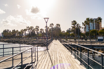 View of beautiful pier on coast with promenade of Limassol, Cyprus from pier during spring sunny...