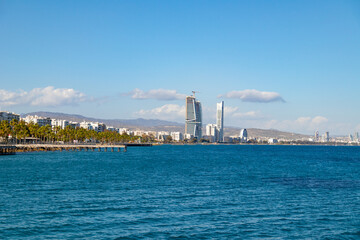 View of beautiful coast with promenade of Limassol, Cyprus from pier during spring sunny day.