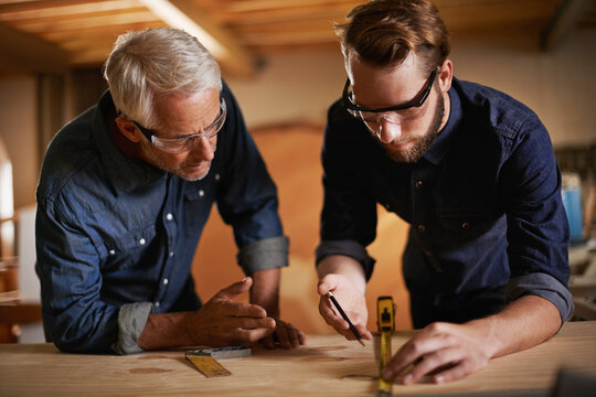 Carpentry, men and measurement in workshop teaching and learning furniture design, manufacturing or internship. Mentorship, carpenter or apprentice at sustainable wood business or teamwork on project