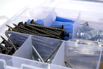 A box with screws and nails. Workplace organization. Repair