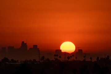 9/7/2022:   A hot summer sun rises over Los Angeles during the end of summer heatwave that caused...