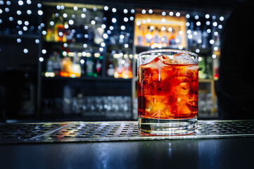 Cocktail Negroni with gin, campari martini rosso and orange. negroni cocktail at the bar