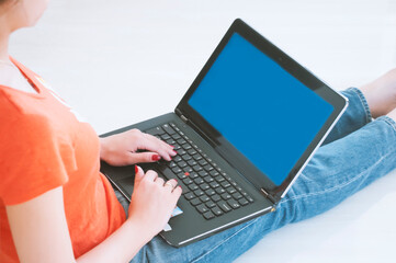 Girl using her laptop in her house.