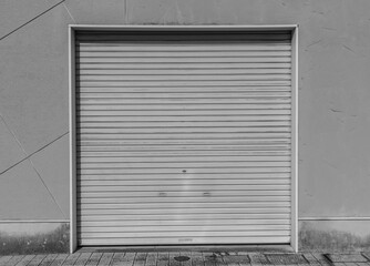 Old weathered and rusty closed steel doors for steel metal store door backgroud and texture.