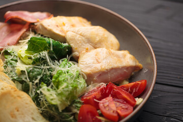 Fried chicken with scrambled eggs, tomatoes, and herbs