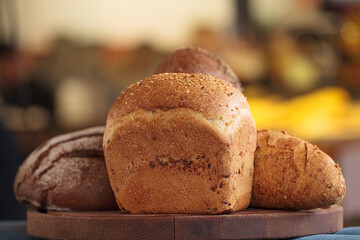 Beautiful fresh bread or flour products on a wooden board