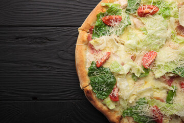 Italian or French pizza with different ingredients. Sausage, meat, cheese, tomatoes.