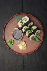 Fototapeta na wymiar Large set of sushi with soy sauce and wasabi