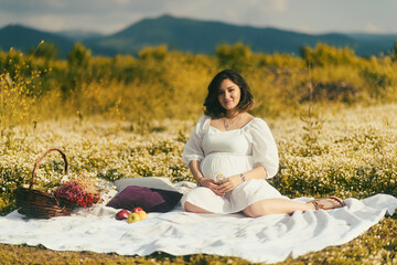 Pregnant woman on picnic