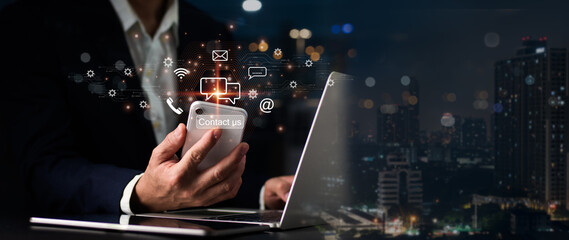 A man displays an operator's logo, which has after-sales service iconography. The communication route for customer satisfaction